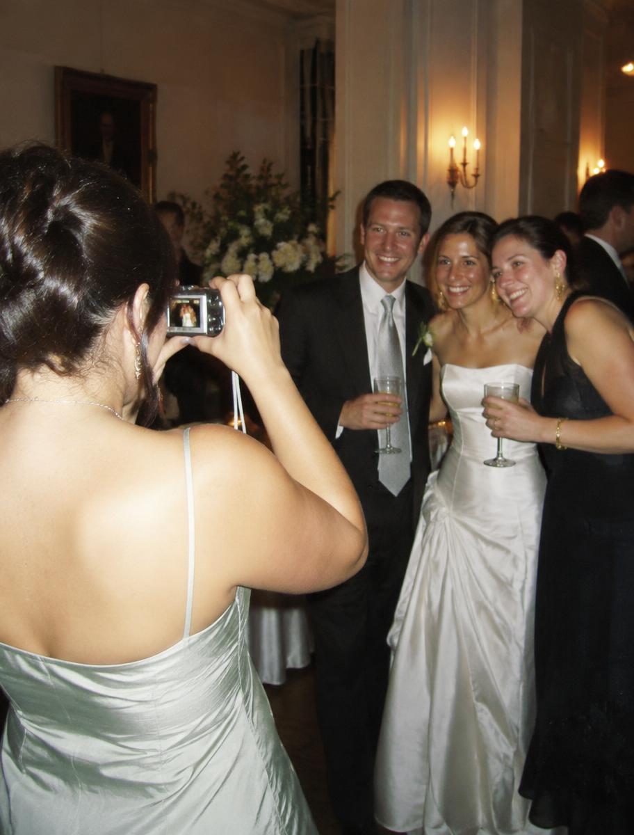 A guest photographing friends with a small compact camera